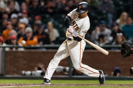 Apr 26, 2023; San Francisco, California, USA; San Francisco Giants first baseman LaMonte Wade Jr. (31) hits an RBI triple against the St. Louis Cardinals during the eighth inning at Oracle Park. Mandatory Credit: John Hefti-USA TODAY Sports