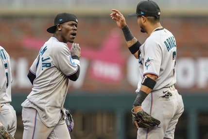 Apr 27, 2023; Cumberland, Georgia, USA; Miami Marlins center fielder Jazz Chisholm Jr. (2) reacts with second baseman Luis Arraez (3) after defeating the Atlanta Braves at Truist Park. Mandatory Credit: Dale Zanine-USA TODAY Sports