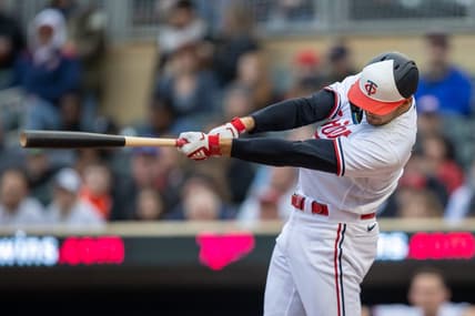 Apr 27, 2023; Minneapolis, Minnesota, USA; Minnesota Twins left fielder Trevor Larnach (9) hits an RBI single in the first inning against the Kansas City Royals at Target Field. Mandatory Credit: Jesse Johnson-USA TODAY Sports