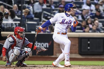 Apr 27, 2023; New York City, New York, USA;  New York Mets third baseman Brett Baty (22) hits a single in the second inning against the Washington Nationals at Citi Field. Mandatory Credit: Wendell Cruz-USA TODAY Sports