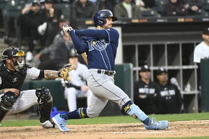 Apr 27, 2023; Chicago, Illinois, USA; Tampa Bay Rays second baseman Brandon Lowe (8) hits a two-run RBI single against the Chicago White Sox during the fifth inning at Guaranteed Rate Field. Mandatory Credit: Matt Marton-USA TODAY Sports