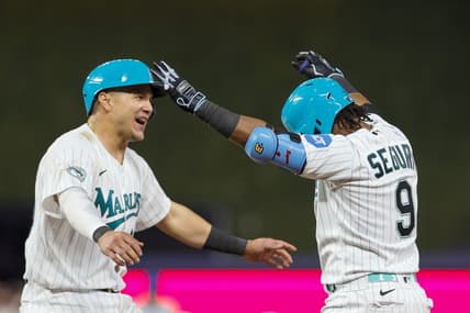 Apr 28, 2023; Miami, Florida, USA; Miami Marlins third baseman Jean Segura (9) celebrates with right fielder Avisail Garcia (24) after hitting a walk-off single during the ninth inning against the Chicago Cubs at loanDepot Park. Mandatory Credit: Sam Navarro-USA TODAY Sports