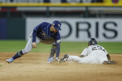 Apr 28, 2023; Chicago, Illinois, USA; Chicago White Sox left fielder Andrew Benintendi (23) steals second base against Tampa Bay Rays second baseman Brandon Lowe (8) during the seventh inning at Guaranteed Rate Field. Mandatory Credit: Kamil Krzaczynski-USA TODAY Sports