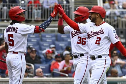 Apr 29, 2023; Washington, District of Columbia, USA; Washington Nationals second baseman Luis Garcia (2) and left fielder Stone Garrett (36) are congratulated by shortstop CJ Abrams (5) after scoring against the Pittsburgh Pirates during the fourth inning at Nationals Park. Mandatory Credit: Brad Mills-USA TODAY Sports