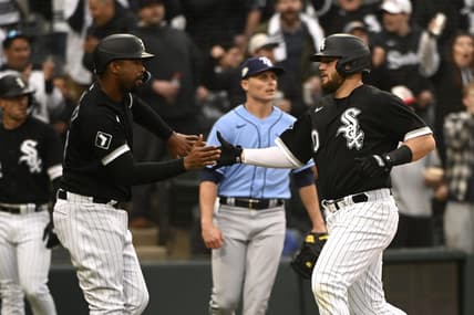 Apr 29, 2023; Chicago, Illinois, USA;  Chicago White Sox designated hitter Eloy Jimenez (74), left, and Chicago White Sox third baseman Jake Burger (30) high five after scoring against the Tampa Bay Rays during the second inning at Guaranteed Rate Field. Mandatory Credit: Matt Marton-USA TODAY Sports