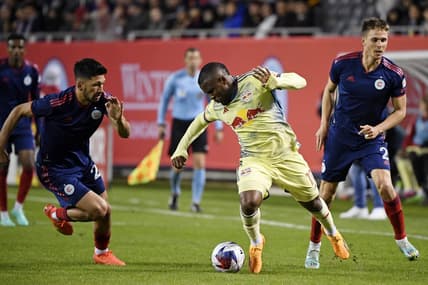 Apr 29, 2023; Chicago, Illinois, USA; New York Red Bulls forward Elias Manoel (11) battles for the ball against Chicago Fire defender Mauricio Pineda (22) during the first half at Soldier Field. Mandatory Credit: Jon Durr-USA TODAY Sports