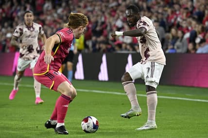 Apr 29, 2023; St. Louis, Missouri, USA; Portland Timbers forward Franck Boli (7) attempts to pass the ball past St. Louis City SC defender Tim Parker (26) at CITYPARK. Mandatory Credit: Scott Rovak-USA TODAY Sports