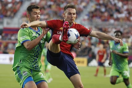 Apr 29, 2023; Sandy, Utah, USA;  Seattle Sounders defender Jackson Ragen (25) and Real Salt Lake forward Danny Musovski (17) battle in the first half at America First Field. Mandatory Credit: Jeffrey Swinger-USA TODAY Sports