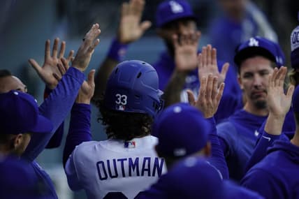 Apr 29, 2023; Los Angeles, California, USA; Los Angeles Dodgers center fielder James Outman (33) is greeted by teammates after scoring a run against the St. Louis Cardinals during the second inning at Dodger Stadium. Mandatory Credit: Lucas Peltier-USA TODAY Sports