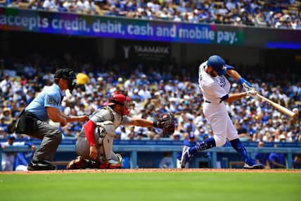 Apr 30, 2023; Los Angeles, California, USA; Los Angeles Dodgers shortstop Chris Taylor (3) hits an RBI double against the St. Louis Cardinals during the fourth inning at Dodger Stadium. Mandatory Credit: Gary A. Vasquez-USA TODAY Sports