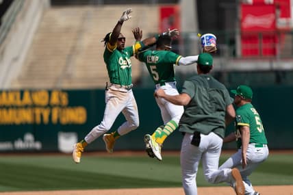 Apr 30, 2023; Oakland, California, USA;  Oakland Athletics second baseman Tony Kemp (5) celebrates with center fielder Esteury Ruiz (1) after defeating the Cincinnati Reds with a walk off single at RingCentral Coliseum. Mandatory Credit: Stan Szeto-USA TODAY Sports