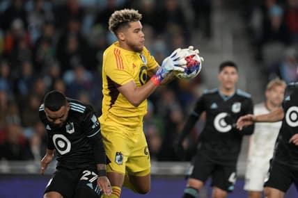 Apr 30, 2023; Saint Paul, Minnesota, USA; Minnesota United goalkeeper Dayne St. Clair (97) controls the ball in front of defender D.J. Taylor (27) in the first half against the FC Dallas at Allianz Field. Mandatory Credit: Matt Blewett-USA TODAY Sports