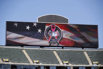 Sep 11, 2021; Oakland, California, USA; The main scoreboard displays the logo to commemorate 9/11 before the game between the Oakland Athletics and the Texas Rangers at RingCentral Coliseum. Mandatory Credit: Darren Yamashita-USA TODAY Sports