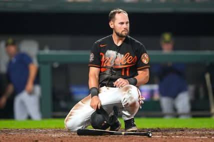 May 20, 2022; Baltimore, Maryland, USA; Baltimore Orioles second baseman Chris Owings (11) reacts to being tagged out a home plate during the fifth inning against the Tampa Bay Rays at Oriole Park at Camden Yards. Mandatory Credit: Gregory Fisher-USA TODAY Sports