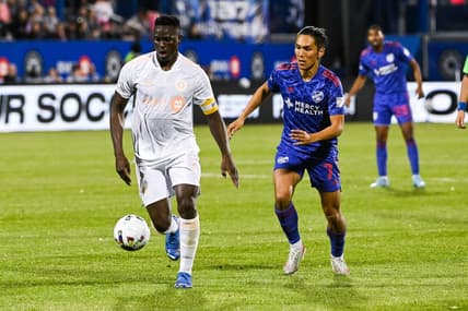 May 28, 2022; Montreal, Quebec, CAN; CF Montreal midfielder Victor Wanyama (2) plays the ball against FC Cincinnati forward Yuya Kubo (7) during the second half at Stade Saputo. Mandatory Credit: David Kirouac-USA TODAY Sports