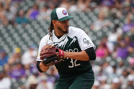 Aug 14, 2022; Denver, Colorado, USA; Colorado Rockies relief pitcher Dinelson Lamet (32) prepares to deliver a pitch in the eighth inning against the Arizona Diamondbacks at Coors Field. Mandatory Credit: Ron Chenoy-USA TODAY Sports