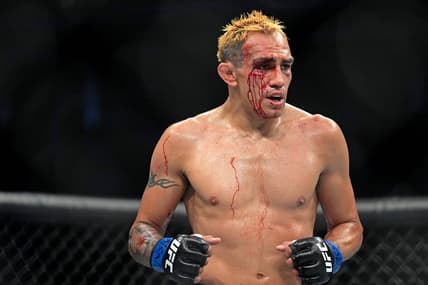 Sep 10, 2022; Las Vegas, Nevada, USA; Tony Ferguson (blue gloves) during UFC 279 at T-Mobile Arena. Mandatory Credit: Joe Camporeale-USA TODAY Sports