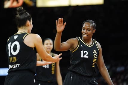Sep 13, 2022; Las Vegas, Nevada, USA; Las Vegas Aces guard Chelsea Gray (12) celebrates with guard Kelsey Plum (10) during the fourth quarter in game two of the 2022 WNBA Finals against the Connecticut Sun at Michelob Ultra Arena. Mandatory Credit: Lucas Peltier-USA TODAY Sports