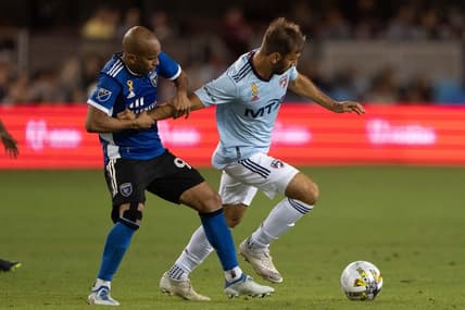Sep 17, 2022; San Jose, California, USA;  San Jose Earthquakes midfielder Judson (93) holds back FC Dallas midfielder Facundo Quignon (5) during the second half at PayPal Park. Mandatory Credit: Stan Szeto-USA TODAY Sports