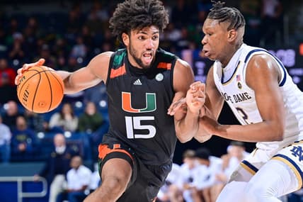 Dec 30, 2022; South Bend, Indiana, USA; Miami Hurricanes forward Norchad Omier (15) drives to the basket as Notre Dame Fighting Irish forward Ven-Allen Lubin (2) defends in the second half at the Purcell Pavilion. Mandatory Credit: Matt Cashore-USA TODAY Sports
