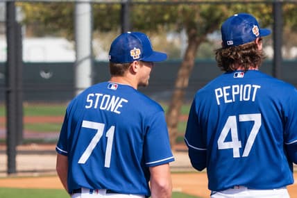 Feb 18, 2023; Glendale, AZ, USA; Los Angeles Dodgers pitchers Gavin Stone (71) and Ryan Pepiot (47) warm up during a spring training workout at Camelback Ranch. Mandatory Credit: Allan Henry-USA TODAY Sports