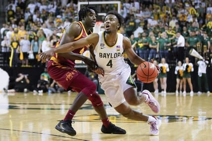 Mar 4, 2023; Waco, Texas, USA; Baylor Bears guard LJ Cryer (4) dribbles around Iowa State Cyclones guard Demarion Watson (4) during the second half at Ferrell Center. Mandatory Credit: Raymond Carlin III-USA TODAY Sports