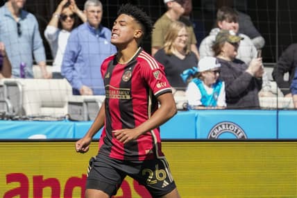 Mar 11, 2023; Charlotte, North Carolina, USA; Atlanta United defender Caleb Wiley (26) celebrates his goal against the Charlotte FC during the first half at Bank of America Stadium. Mandatory Credit: Jim Dedmon-USA TODAY Sports