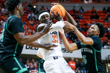 Oklahoma State forward Moussa Cisse (33) works past defenders in the first half during a college basketball game in the quarterfinals of the National Invitational Tournament between the Oklahoma State Cowboys (OSU) and the North Texas Mean Green at Gallagher-Iba Arena in Stillwater, Okla., Tuesday, March 21, 2023.

Osu Vs Nt