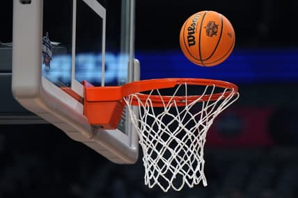 Mar 30, 2023; Dallas, TX, USA;  A Wilson EVO NXT basketball with the NCAA Women's Final Four logo goes through the rim and net at American Airlines Center. Mandatory Credit: Kirby Lee-USA TODAY Sports