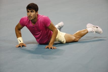 Mar 31, 2023; Miami, Florida, US; Carlos Alcaraz (ESP) falls to the court after diving for a shot against Jannik Sinner (ITA) (not pictured) in a men's singles semifinal on day twelve on the Miami Open at Hard Rock Stadium. Mandatory Credit: Geoff Burke-USA TODAY Sports