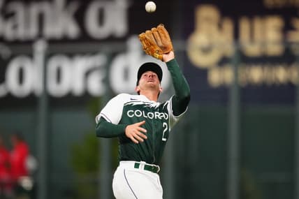 Apr 8, 2023; Denver, Colorado, USA; Colorado Rockies center fielder Yonathan Daza (2) field the ball in the sixth inning against the Washington Nationals at Coors Field. Mandatory Credit: Ron Chenoy-USA TODAY Sports