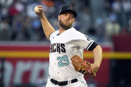 Apr 11, 2023; Phoenix, Arizona, USA; Arizona Diamondbacks starting pitcher Merrill Kelly (29) throws against the Milwaukee Brewers in the first inning at Chase Field. Mandatory Credit: Rick Scuteri-USA TODAY Sports