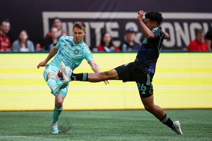 Apr 23, 2023; Atlanta, Georgia, USA; Chicago Fire defender Arnaud Souquet (2) battles for the ball against Atlanta United defender Caleb Wiley (26) during the second half at Mercedes-Benz Stadium. Mandatory Credit: Brett Davis-USA TODAY Sports