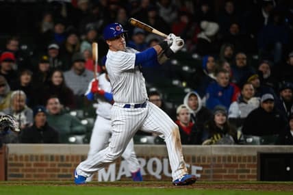 Apr 25, 2023; Chicago, Illinois, USA;  Chicago Cubs catcher Yan Gomes (15) hits an RBI single against the San Diego Padres during the eighth inning  at Wrigley Field. Mandatory Credit: Matt Marton-USA TODAY Sports