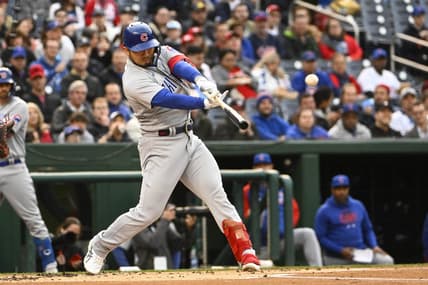 May 1, 2023; Washington, District of Columbia, USA; Chicago Cubs right fielder Seiya Suzuki (27) hits an RBI single against the Washington Nationals during the first inning at Nationals Park. Mandatory Credit: Brad Mills-USA TODAY Sports