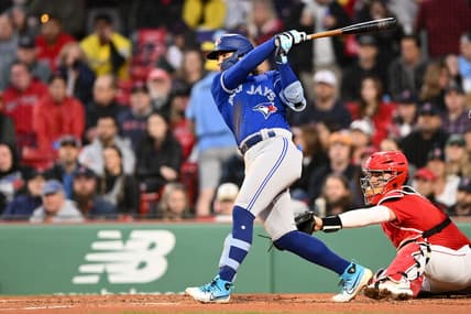 May 1, 2023; Boston, Massachusetts, USA; Toronto Blue Jays shortstop Bo Bichette (11) hits a three-run home run against the Boston Red Sox during the second inning at Fenway Park. Mandatory Credit: Brian Fluharty-USA TODAY Sports