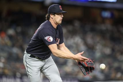 May 1, 2023; Bronx, New York, USA;  Cleveland Guardians starting pitcher Cal Quantrill (47) makes a flip throw to first base for an assist in the seventh inning against the New York Yankees at Yankee Stadium. Mandatory Credit: Wendell Cruz-USA TODAY Sports