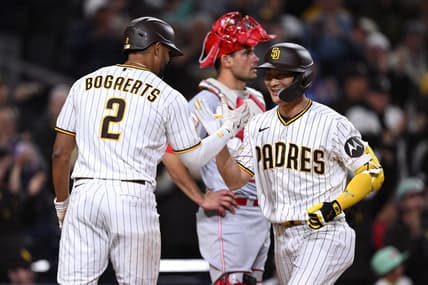 May 1, 2023; San Diego, California, USA; San Diego Padres second baseman Ha-seong Kim (7) is congratulated by shortstop Xander Bogaerts (2) after hitting a three-run home run against the Cincinnati Reds during the fifth inning at Petco Park. Mandatory Credit: Orlando Ramirez-USA TODAY Sports