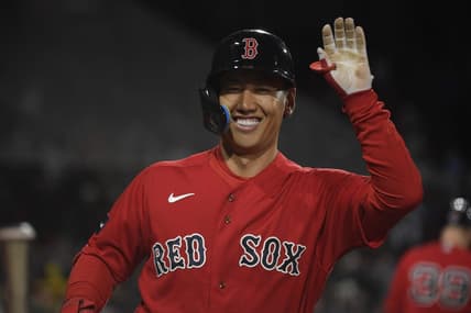 May 2, 2023; Boston, Massachusetts, USA;  Boston Red Sox designated hitter Masataka Yoshida (7) high fives a teammate after hitting a home run during the fourth inning against the Toronto Blue Jays at Fenway Park. Mandatory Credit: Bob DeChiara-USA TODAY Sports