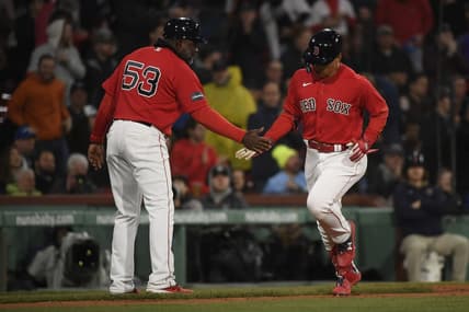 May 2, 2023; Boston, Massachusetts, USA;  Boston Red Sox designated hitter Masataka Yoshida (7) is congratulated by third base coach Carlos Febles (53) after hitting a home run during the fifth inning against the Toronto Blue Jays at Fenway Park. Mandatory Credit: Bob DeChiara-USA TODAY Sports