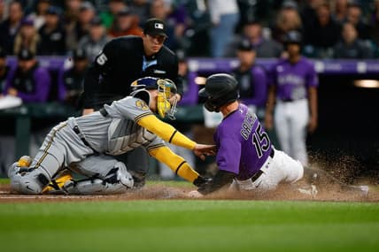 May 2, 2023; Denver, Colorado, USA; Colorado Rockies right fielder Randal Grichuk (15) is tagged out sliding into home against Milwaukee Brewers catcher William Contreras (24) in the fourth inning at Coors Field. Mandatory Credit: Isaiah J. Downing-USA TODAY Sports