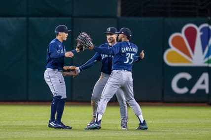 May 2, 2023; Oakland, California, USA;  Seattle Mariners center fielder Jarred Kelenic (10), right fielder Teoscar Hernandez (35) and Seattle Mariners left fielder Sam Haggerty (0) celebrate after defeating the Oakland Athletics at RingCentral Coliseum. Mandatory Credit: Neville E. Guard-USA TODAY Sports