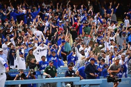 May 3, 2023; Los Angeles, California, USA; Fans cheer after Los Angeles Dodgers third baseman Max Muncy (13) hits a walk off grand slam home run against the Philadelphia Phillies during the ninth inning at Dodger Stadium. Mandatory Credit: Gary A. Vasquez-USA TODAY Sports