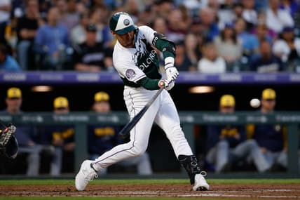 May 3, 2023; Denver, Colorado, USA; Colorado Rockies second baseman Alan Trejo (13) hits a three RBI double in the fourth inning against the Milwaukee Brewers at Coors Field. Mandatory Credit: Isaiah J. Downing-USA TODAY Sports