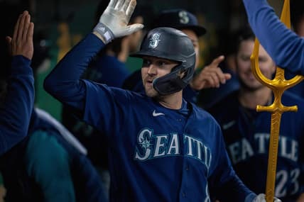 May 3, 2023; Oakland, California, USA; Seattle Mariners left fielder AJ Pollock (8) celebrates in the dugout after hitting a solo home run against the Oakland Athletics during the ninth inning at Oakland-Alameda County Coliseum. Mandatory Credit: Neville E. Guard-USA TODAY Sports