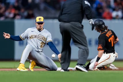 May 5, 2023; San Francisco, California, USA;  San Francisco Giants second baseman Brett Wisely (70) steals second base in front of Milwaukee Brewers shortstop Willy Adames (27) during the second inning at Oracle Park. Mandatory Credit: John Hefti-USA TODAY Sports