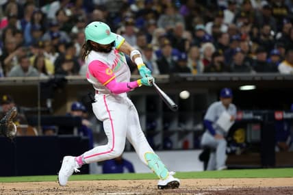 May 5, 2023; San Diego, California, USA;  San Diego Padres right fielder Fernando Tatis Jr. (23) hits a home run during the fifth inning against the Los Angeles Dodgers at Petco Park. Mandatory Credit: Kiyoshi Mio-USA TODAY Sports