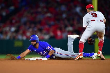 May 5, 2023; Anaheim, California, USA; Texas Rangers center fielder Leody Taveras (3) reaches second on a double ahead of Los Angeles Angels shortstop Zach Neto (9) during the fifth inning at Angel Stadium. Mandatory Credit: Gary A. Vasquez-USA TODAY Sports