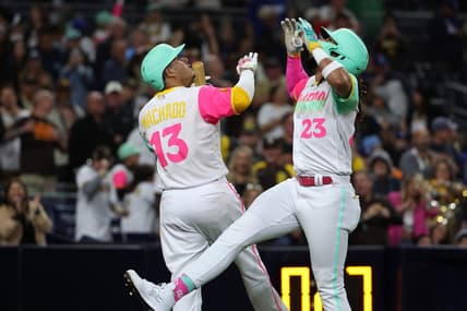 May 5, 2023; San Diego, California, USA;  San Diego Padres right fielder Fernando Tatis Jr. (23) celebrates with third baseman Manny Machado (13) after hitting a home run during the fifth inning against the Los Angeles Dodgers at Petco Park. Mandatory Credit: Kiyoshi Mio-USA TODAY Sports