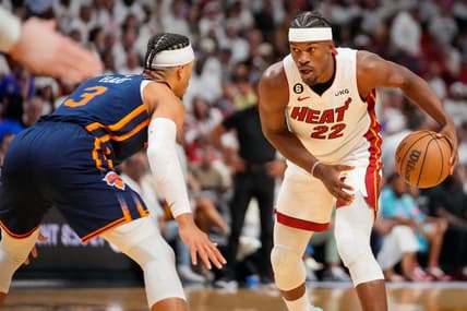 May 6, 2023; Miami, Florida, USA; Miami Heat forward Jimmy Butler (22) looks to dribble the ball as New York Knicks guard Miles McBride (2) defends during the second half of game three of the 2023 NBA playoffs at Kaseya Center. Mandatory Credit: Rich Storry-USA TODAY Sports